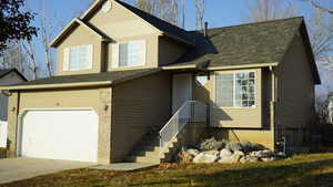 View of front of property featuring a garage