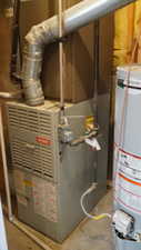 Utilities featuring gas water heater and heating unit