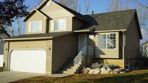 View of front of home featuring a garage