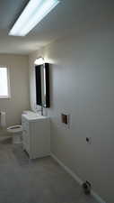 Bathroom with vanity and toilet