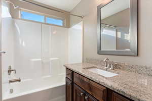 Bathroom with vanity and shower / bathtub combination