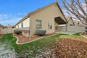 Back of house featuring a yard and a patio