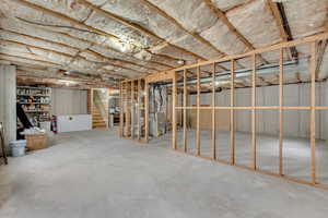 Basement featuring heating unit