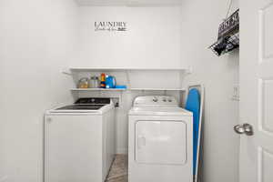 Laundry room featuring washing machine and dryer