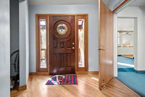 Foyer featuring hardwood / wood-style floors and ceiling fan