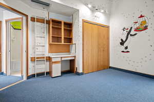 Unfurnished bedroom with a closet and carpet