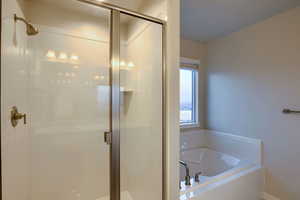 Bathroom featuring separate shower and tub