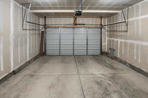 Garage featuring a garage door opener