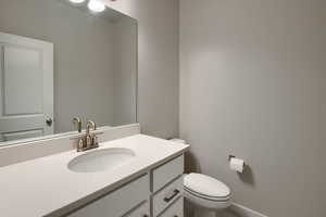 Bathroom featuring vanity and toilet