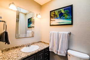 Bathroom with vanity and toilet