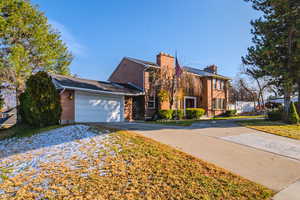 View of front of home featuring a garage