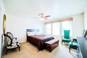 Bedroom featuring light carpet and ceiling fan