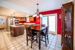 Dining space with sink and a chandelier