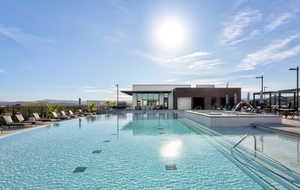 View of community pool featuring a mountain view, a community hot tub, a patio area, and private cabanas