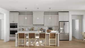 Kitchen with a kitchen bar, a center island with sink, light hardwood / wood-style flooring, and appliances with stainless steel finishes*Rendering