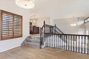 Staircase with hardwood / wood-style floors