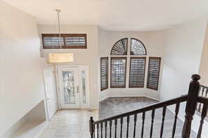 Entryway featuring a towering ceiling