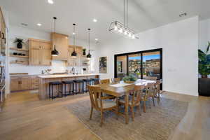 Dining area featuring light wood-type flooring and sink