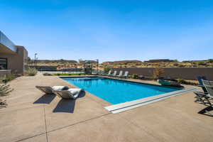 View of swimming pool featuring a patio