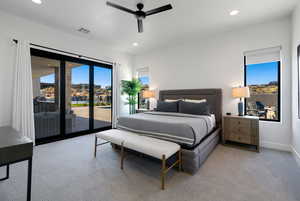 Bedroom with ceiling fan, access to exterior, and light carpet