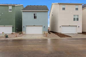 Rear view of house with a garage