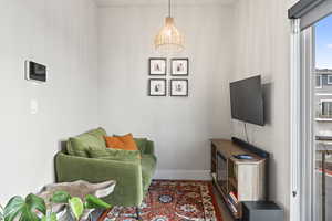 Living area with hardwood / wood-style floors