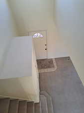 Foyer featuring carpet