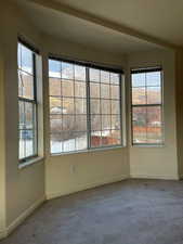 Empty room featuring carpet floors