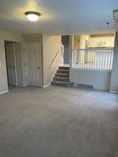 Interior space featuring light carpet