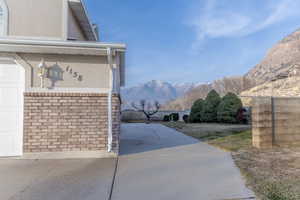 Exterior space with a mountain view and a garage