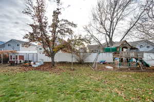 View of yard featuring a playground