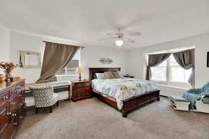 Master bedroom featuring ceiling fan