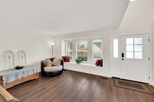 Entrance foyer with dark wood-type flooring