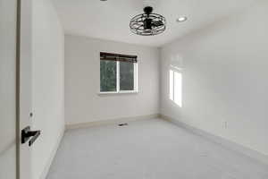 Upstairs Bedroom 2 with ceiling fan