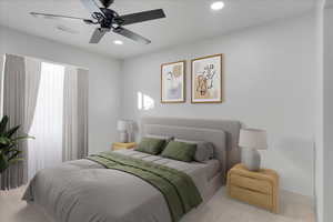 Bedroom featuring ceiling fan and light carpet