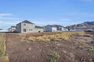 Rear view of property featuring a mountain view