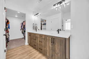 Bathroom featuring hardwood / wood-style floors and vanity