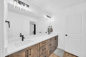 Bathroom with vanity and hardwood / wood-style flooring