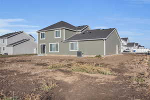 Back of house with central air condition unit