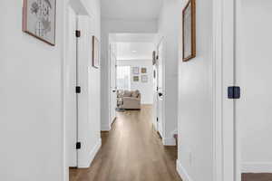 Hallway featuring hardwood / wood-style floors