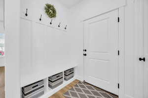 Mudroom featuring wood-type flooring