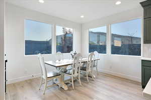 Dining room featuring a mountain view and light hardwood / wood-style floors