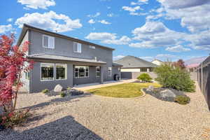 Rear view of property with a patio