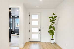 Entryway featuring ceiling fan and light hardwood / wood-style flooring