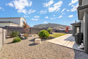 View of yard featuring a mountain view and a patio area