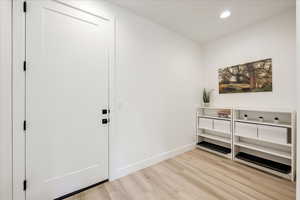 Foyer entrance featuring light hardwood / wood-style flooring