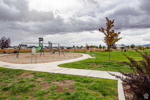 View of play area with a yard