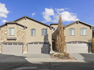 View of front facade featuring a garage