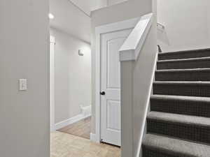 Stairway with hardwood / wood-style flooring