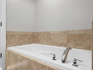 Bathroom with a relaxing tiled tub